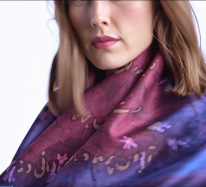 Woman wearing a purple patterned scarf with person calligraphy on a white background designed by Maryam Mohi